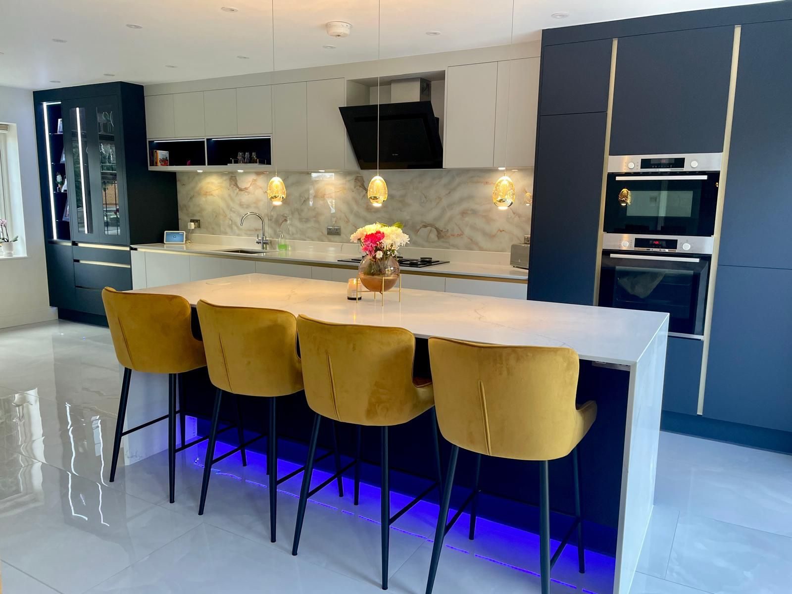 Blue fitted kitchen installed in West London